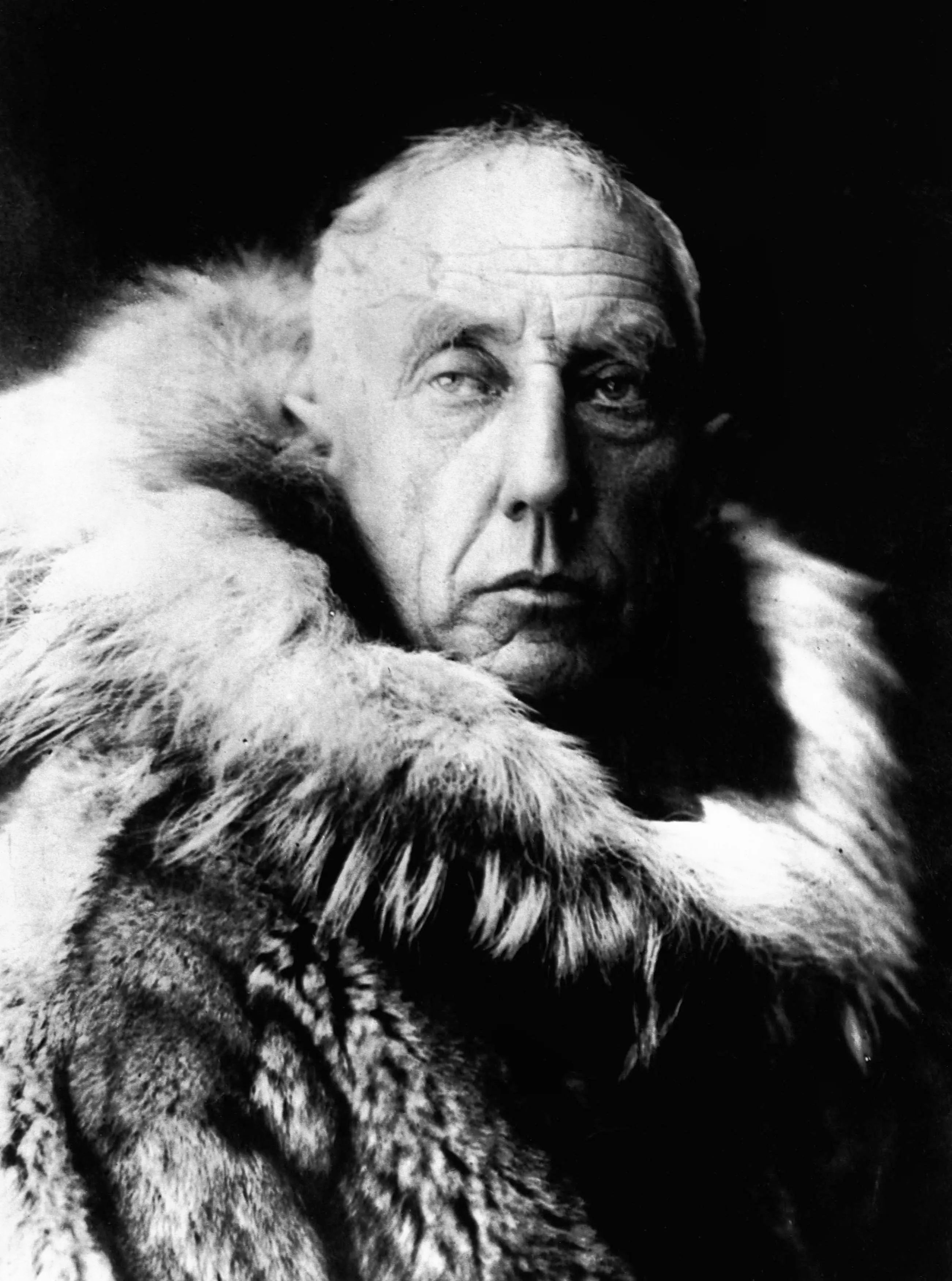 Roald Amundsen in polar furs and gabardine outerwear.