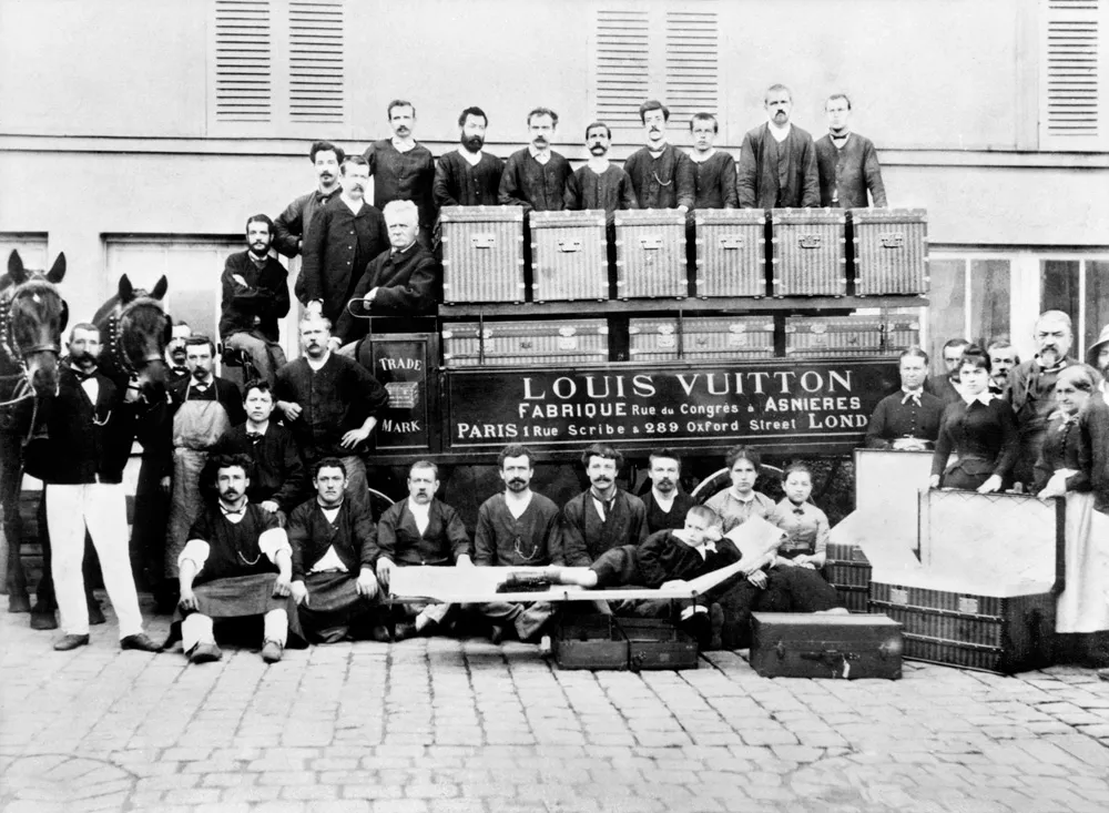 Three generations of the Vuitton family in the courtyard of the Asnières workshops.