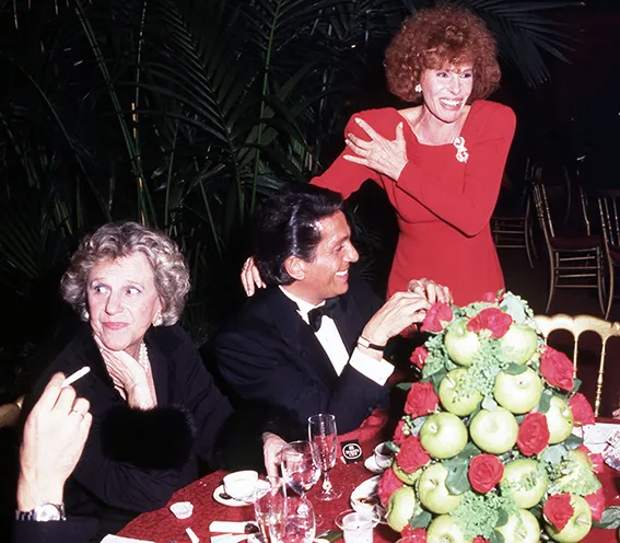Anna Bonomi Bolchini, Valentino Garavani and Ornella Vanoni at the 1985 "L'Atelier delle Illusioni" exhibition, Castello Sforzesco, Milan.